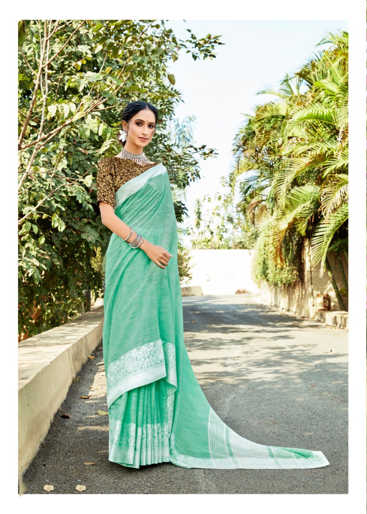 Borderless tea green lucknowi chikankari cotton saree features intricate  designs all over its body & pallu