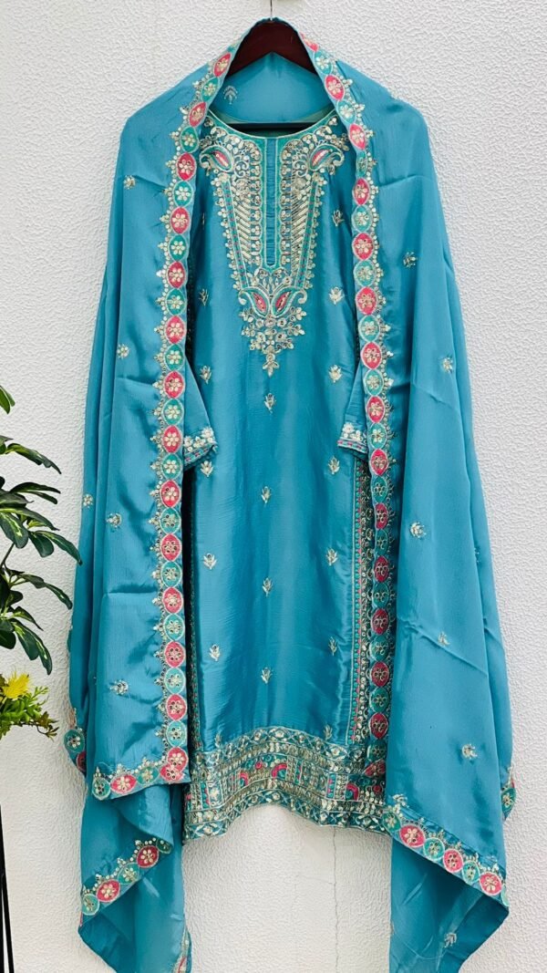 Sky Blue Colour Pure Chinnon Silk With Heavy Embroidery Suit
