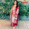 Model wearing a crimson maroon Aasha Designer pure cotton Pakistani suit with heavy embroidered neckline patches.