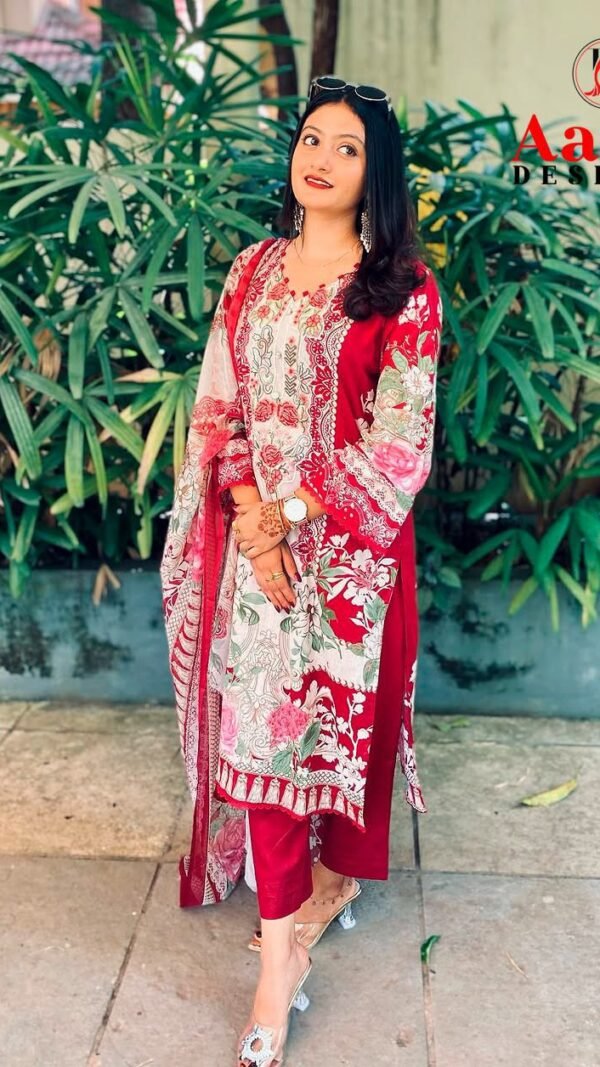 Model wearing a crimson maroon Aasha Designer pure cotton Pakistani suit with heavy embroidered neckline patches.